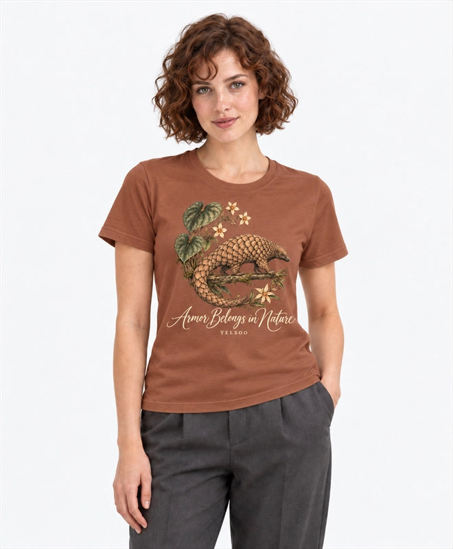 YELSOO women's Armor Belongs in Nature Pangolin Graphic Tee in Clay Brown — front model view