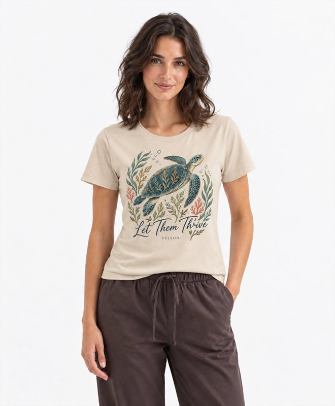 YELSOO women's Let Them Thrive Sea Turtle Graphic Tee in Sand — front model view