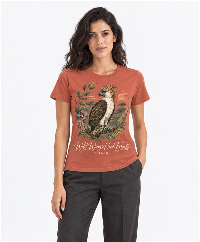 YELSOO women's Wild Wings Need Forests Philippine Eagle Graphic Tee in Terracotta — front model view