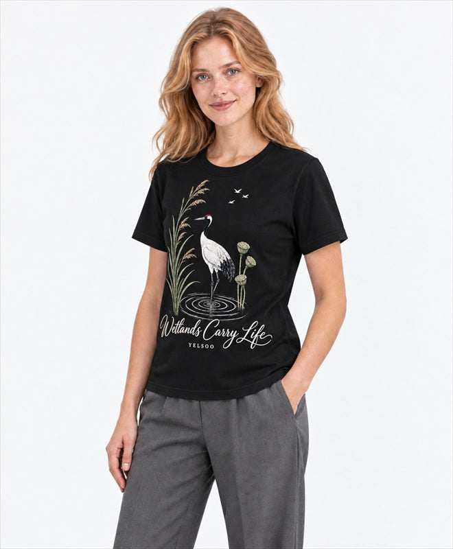 YELSOO men's Wetlands Carry Life Red-Crowned Crane Graphic Tee in Black — three-quarter model view