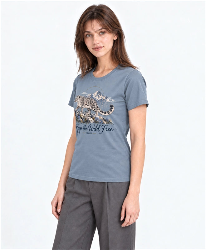 YELSOO women's Keep the Wild Free Snow Leopard Graphic Tee in Slate Blue — three-quarter model view