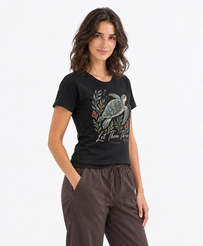 YELSOO women's Let Them Thrive Sea Turtle Graphic Tee in Black — three-quarter model view
