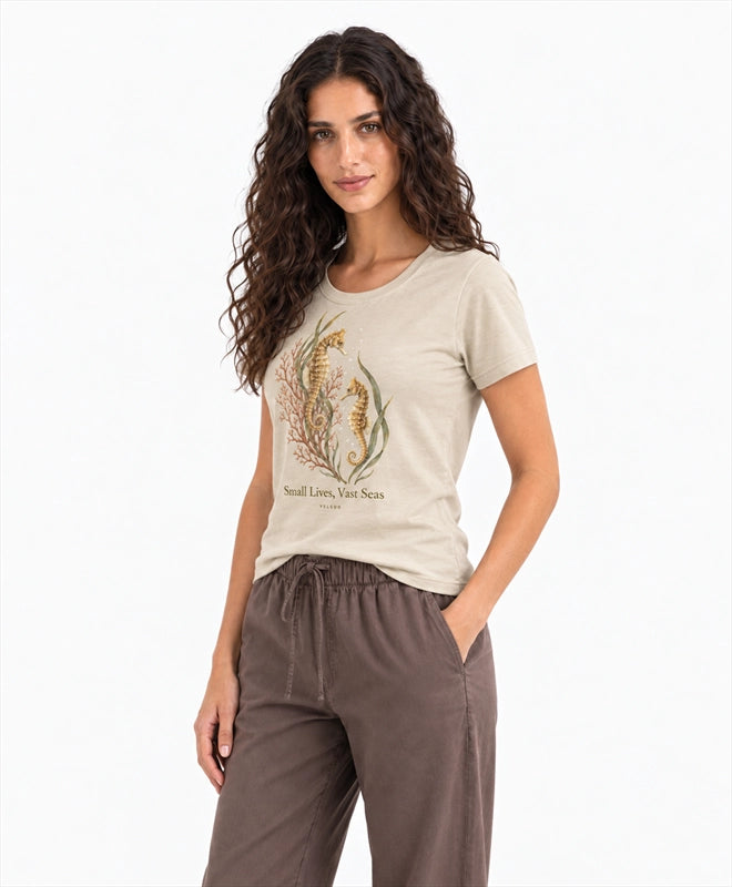 YELSOO women's Small Lives Vast Seas Seahorse Graphic Tee in Light Sand — three-quarter model view