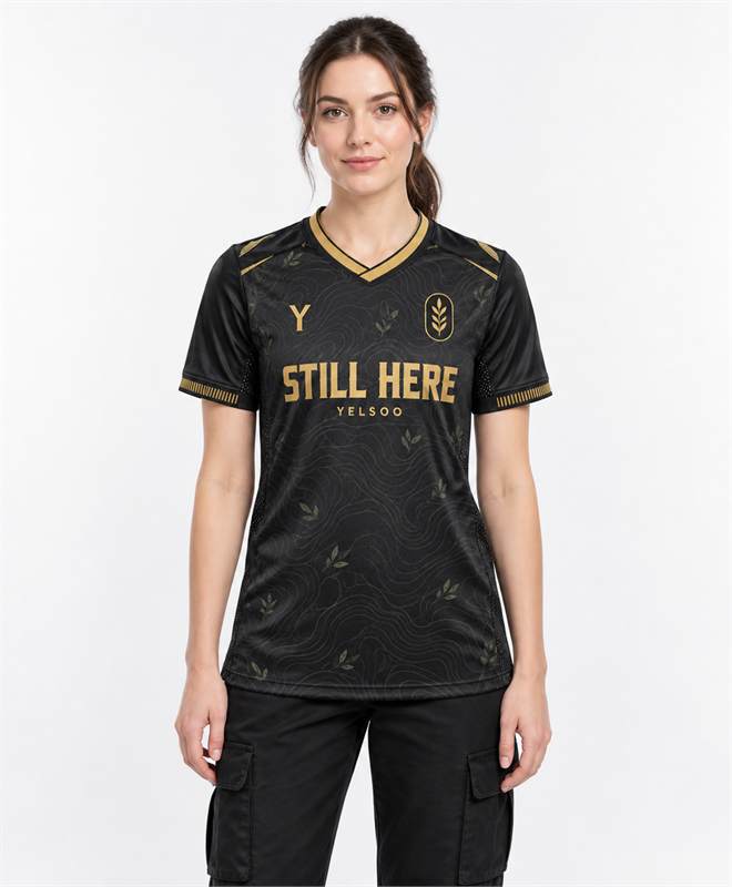 YELSOO Unisex Still Here Jersey in black gold — female model front view