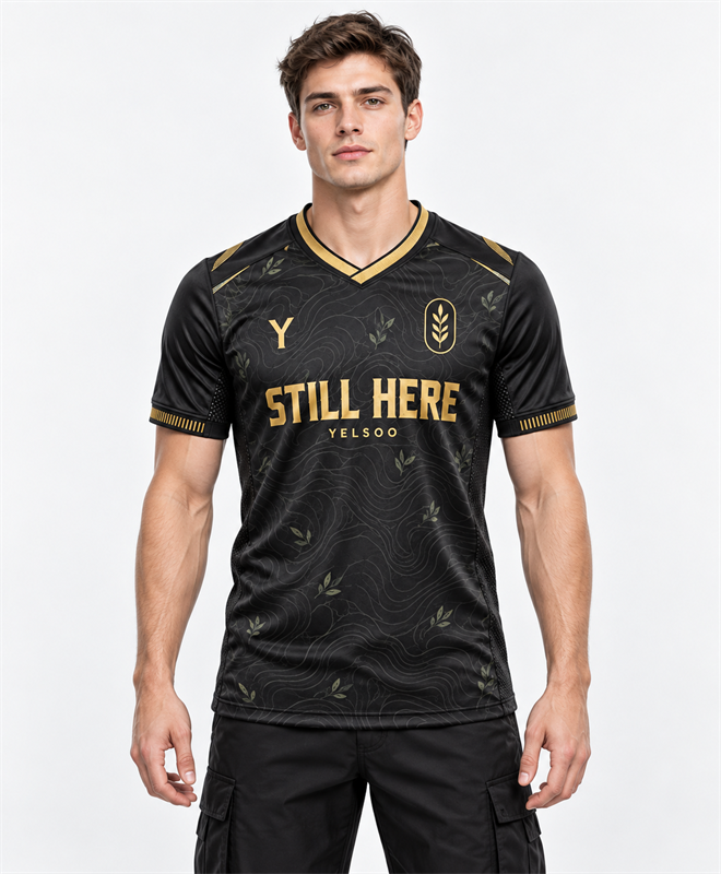 YELSOO Unisex Still Here Jersey in black gold — model front view